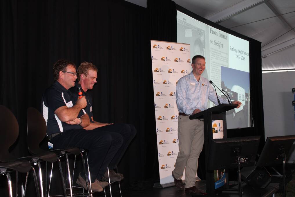 Western Dairy agribusiness team leader Kirk Reynolds (at the lectern), at Dairy Innovation Day with host family father and son Robin and Wes Lammie.
