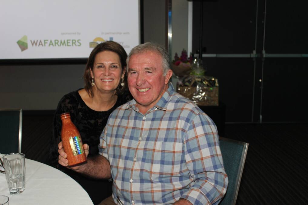 Former Harvey dairy farmers Jayne and Graham Manning with the WAFarmers' Milk Bottle award recognising 164 years of service to the dairy industry by Mr Manning and four generations of his family before him.