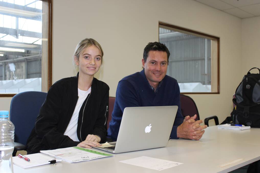A fresh face among the wool buyers in the auction room at the Western Wool Centre, Georgie Foley, 20, is learning the wool trade from the father, Swan Wool Processing managing director Paul Foley. She is pictured with Swan wool buyer Phil Roberts.