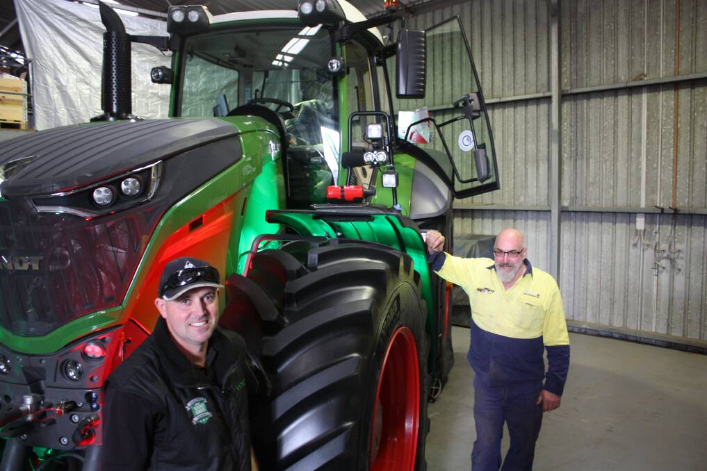 C & C Machinery Albany dealer principal Matt Pearce (left) and local contractor Bill Gibbs, next to the new Fendt Vario 1050 which Bill has ordered for his business.