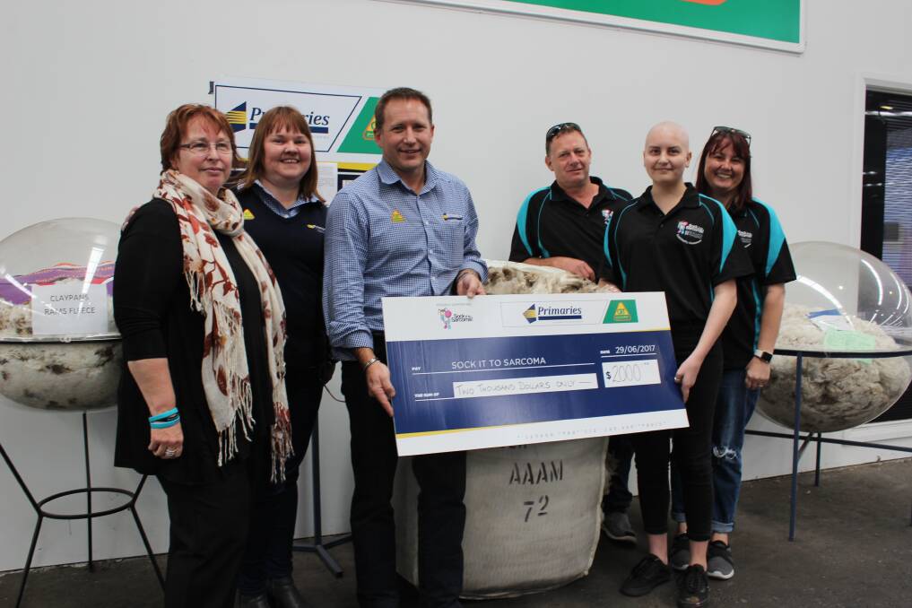 Mandy Basson (left), Sock It To Sarcoma!, Shona MacKillop, Primaries of WA customer service, Greg Tilbrook, Primaries of WA wool manager with synovial sarcoma sufferer Jordyn Fairhead, 15, Ravensthorpe, and her parents Cameron and Dana. The $2000 donation was raised by selling the bale of wool between them.