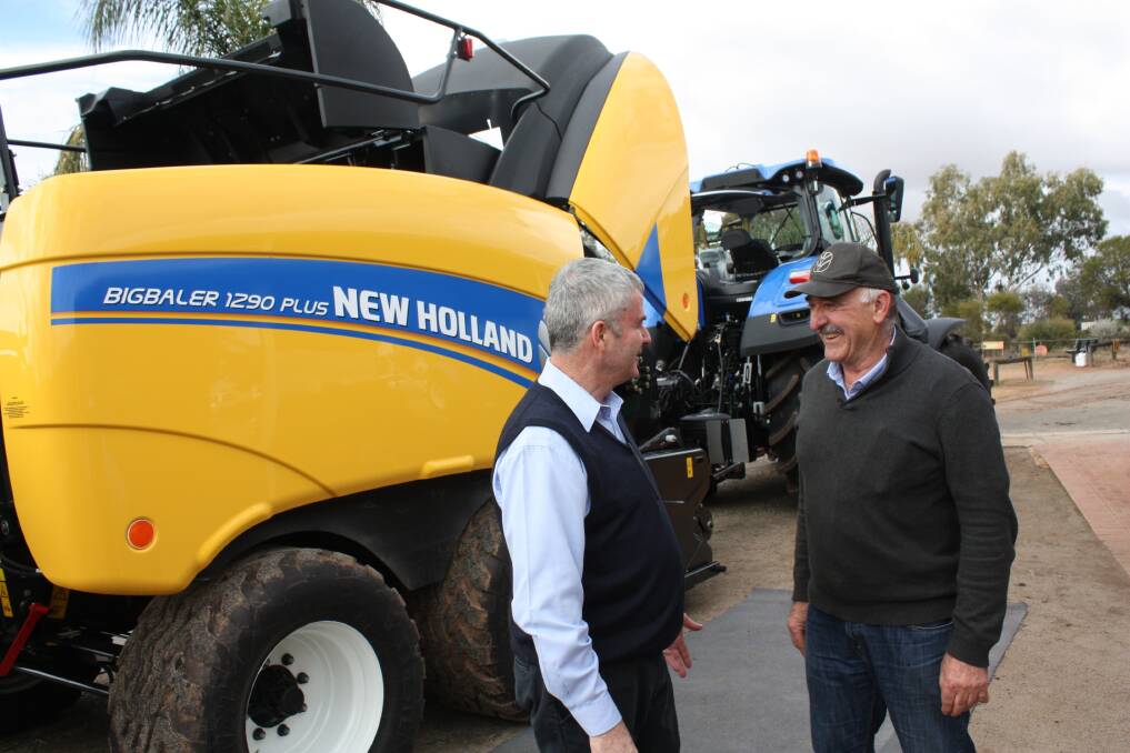 New Holland national product manager Tony Peters (left) and Cootes Motors dealer principal Barry Coote, Brookton, during one of the New Holland roadshow presentations held in Brookton last week.