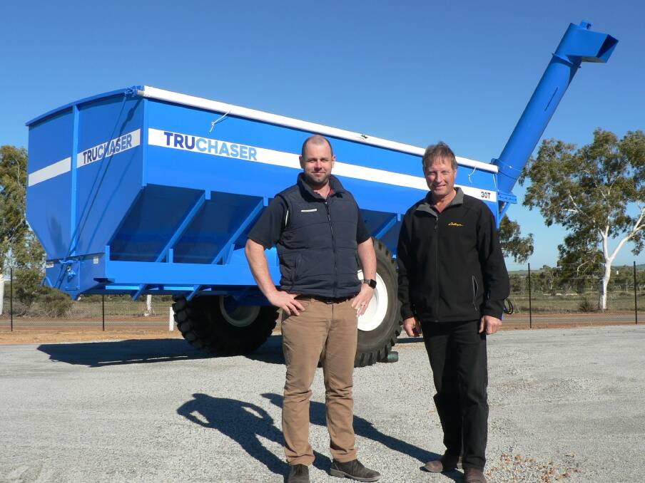McIntosh & Son Wongan Hills, Moora and Merredin dealer principal Anthony Ryan (left) and Wongan Hills and Merredin sales manager David Trindall with the new TRUCHASER chaser bin, which is exclusive to McIntosh & Son and is based on Trufab's recent Grain King models. 