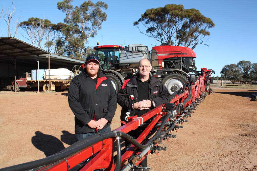 Farmers Centre 1978 Katanning branch manager Kevin Newman (right) and salesman Stephen Brookes check out a new Case IH Patriot self-propelled boomsprayer with new AIM Command Flex technology. 