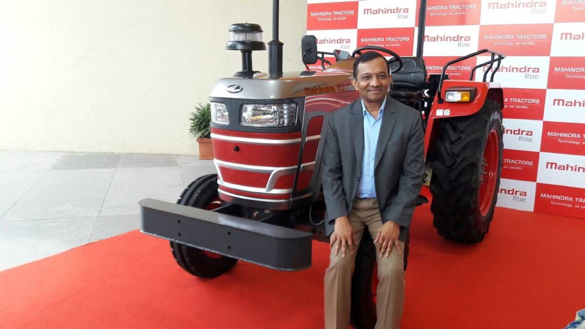  Mahindra & Mahindra Ltd. managing director Dr Pawan Goenka with the company's new driverless tractor. Mahindra expects to start commercial production early next year. See story.