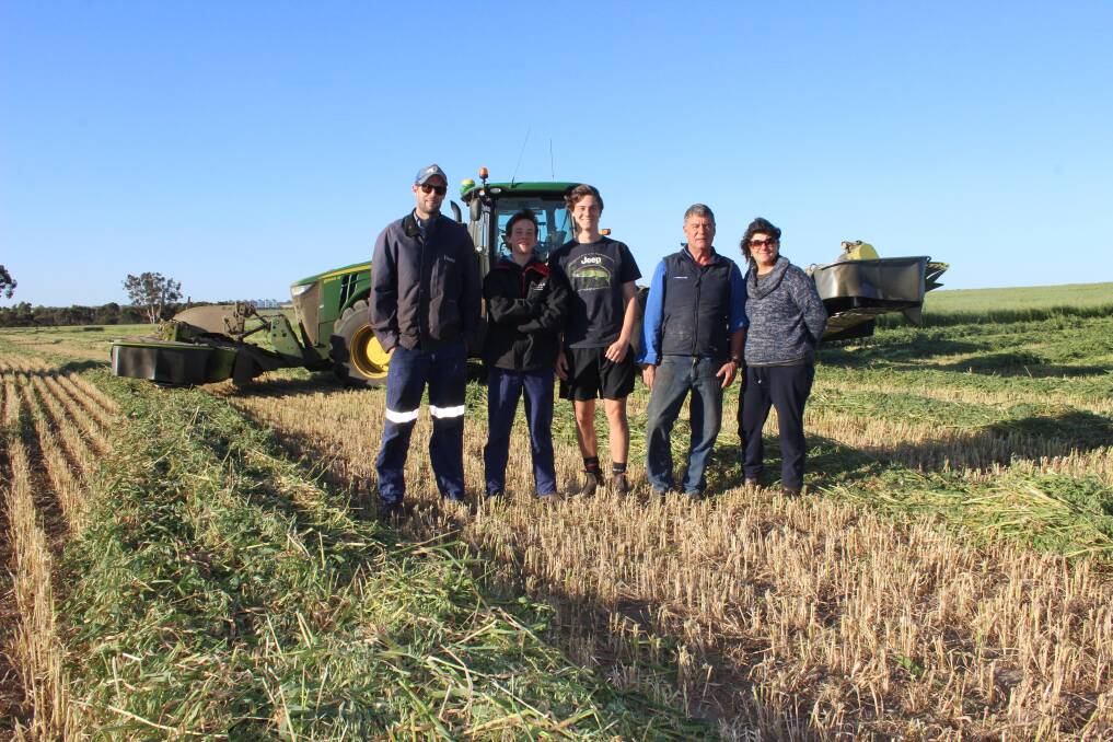  Calingiri hay makers Brent Leeson (left) with Isaac, Jerome, Steve and Susan Woods from Emdavale Farms in front of the auto steer, GPS-guided, John Deere tractor they have been trialling this season.