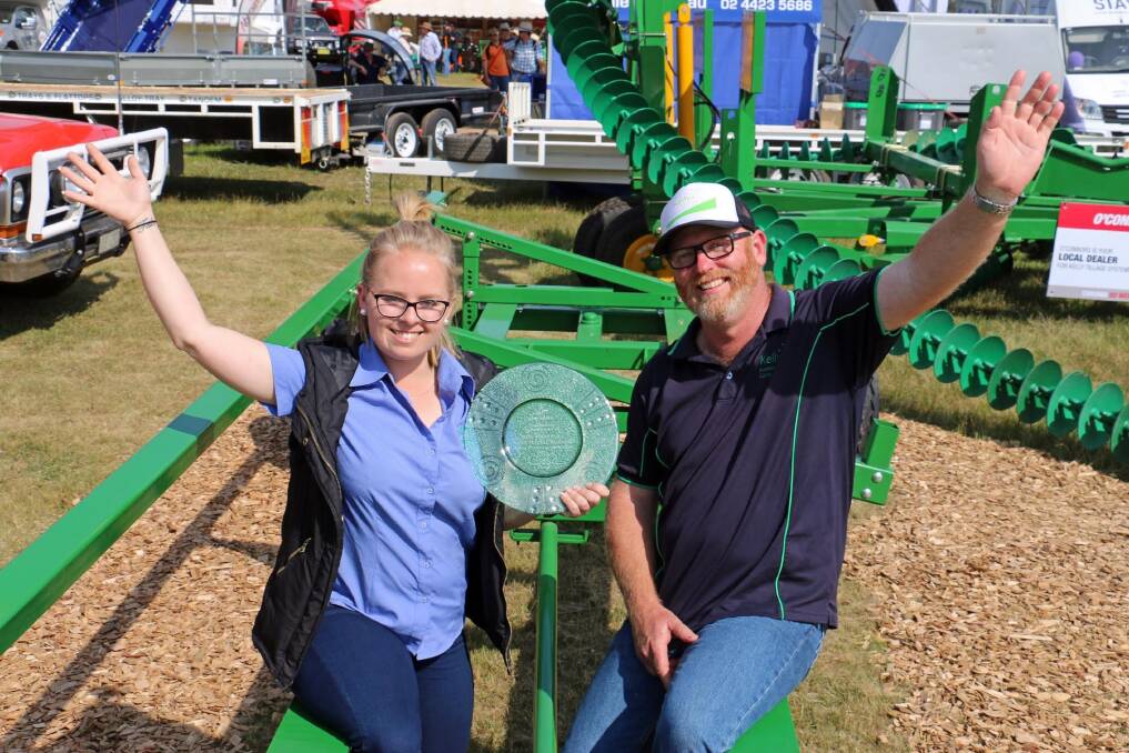 Taylor Reid (left) and Cavin Osborn celebrate Kelly Engineering's win for the best designed and manufactured Australian machine at the Henty Machinery Field Days held at Henty, New South Wales recently.