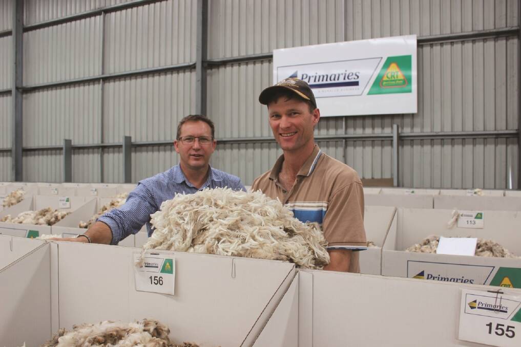 Primaries of WA wool manager Greg Tilbrook (left) and Peter Wilkinson, Challara Merino stud, Badgingarra, with some of the hogget wool from a nine-month shearing.
