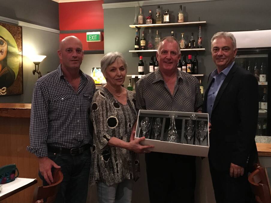  Landmark general manager southern Justin Lynn (left) and national livestock manager Leon Giglia (right) thanked Bob Pumphrey for his many years of hard work in the Landmark uniform, pictured here with wife Mary at a dinner last week in Albany.