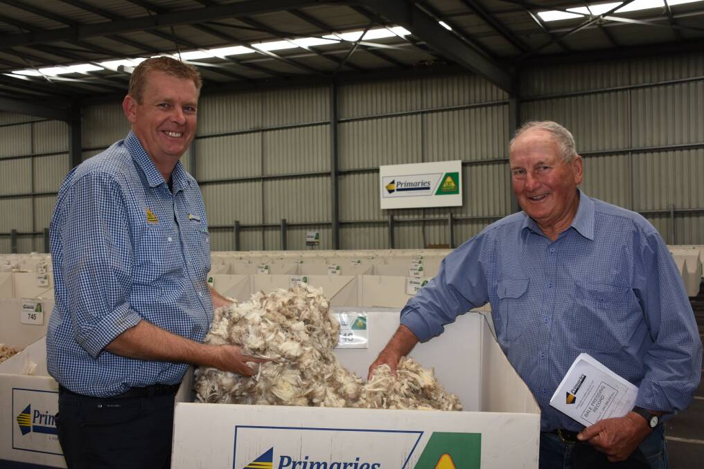  Primaries wool marketing representative Steve Squire (left) and Geoff Shepherdson, Anglesey Poll Merino stud, Gnowangerup, were all smiles when they caught up at the Primaries wool stores after last week's wool sale, where they looked at the operations sample of lambs wool which sold for 1556c/kg greasy or $2924 a bale. The line of nine bales averaged 16.7 micron, 72.2 per cent yield, 0.3pc veget