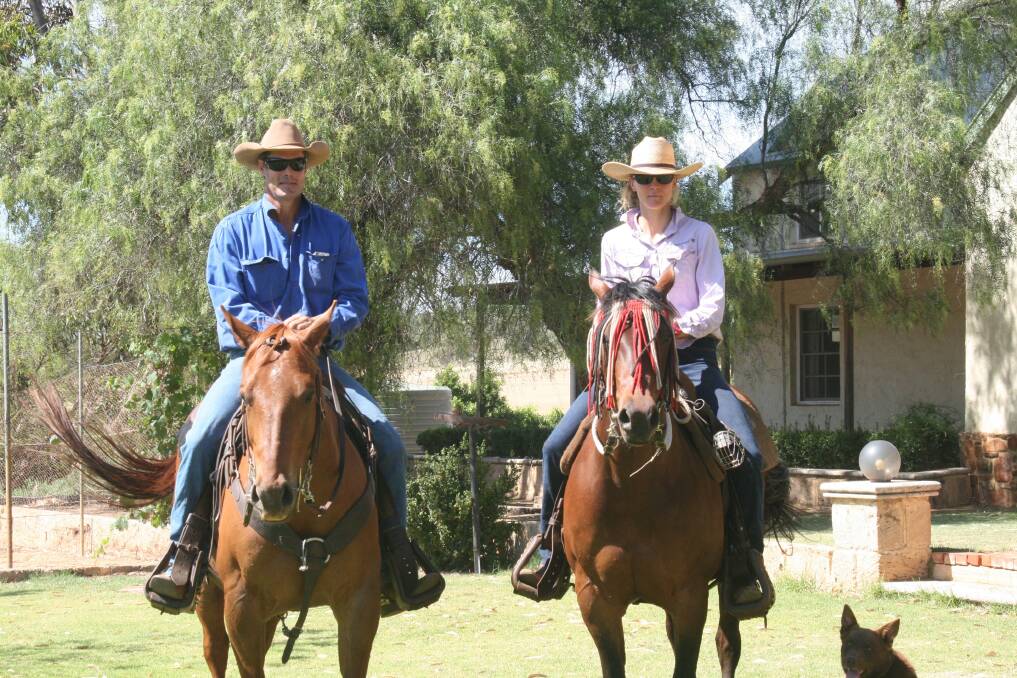  Zach (left) on his horse Koda, with Margriet on Kate and dog Bear