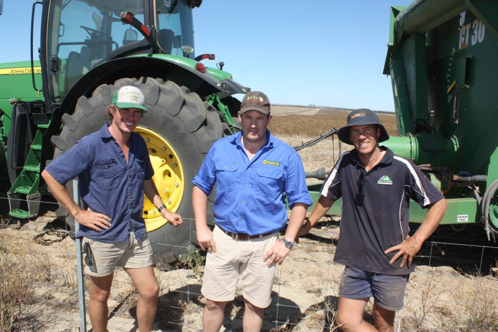Mullewa south farmers Tim (left) and James Dempster flank Burando Hill Geraldton manager Johnathan Moss completed one of the last paddocks of lupins two weeks ago. "We finished better than expected," Tim said. "That August and September rain got us out of jail, particularly with the wheat. "Lupins finished better than expected while canola was on par. "We had a mid-year budget review and we're w