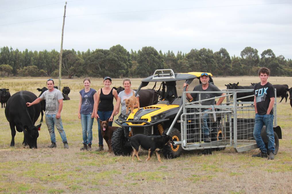 The Blyth family cattle operation at Manypeaks includes Rob Potter (left), Caitlin Vandelaar and Bianca, Rebecca, Jeff and Callum Blyth. The family is pictured with a calf catcher they had made locally and use hooked up to a CanAm side by side. The catcher was used for the first time last year and Rebecca said it made the whole calf marking process significantly easier.