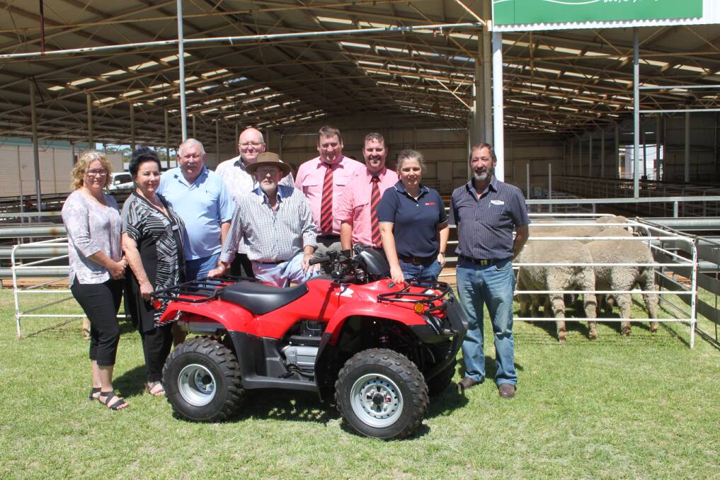 With Honda TRX 250TM 4-wheel motorbike to be offered as the major prize for the supreme grand champion Merino at the 2018 Wagin Woolorama were Woolorama officials, Diana Blacklock (left), Carolyn Webster, committee member Malcolm Edward, VP Keven Nordstrom, president Tony Baxter, Tim Spicer and Nathan King representing Elders, Jodie Rintoul Farm Weekly and bike supplier Geoff Perkins. 