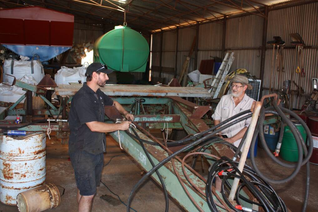 Steve Hancock (left), Midwest Rewinds and retired Department of Primary Industries and Regional Development researcher Dr Paul Blackwell, busy converting an old John Shearer Trashworker into a deep ripper.