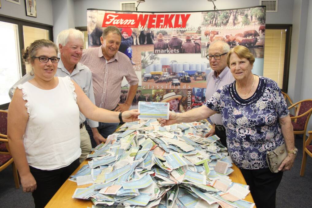 Farm Weekly livestock manager Jodie Rintoul (left) and Beth McKay, formerly Wilson Downs Angus stud, Cunderdin, hold the winning ticket, while WA Angus Society representative Bruce Campbell (second left), vice chairman Mark Hattingh and Beth’s husband John, marvel at the more than 14,000 entries received in the competition.