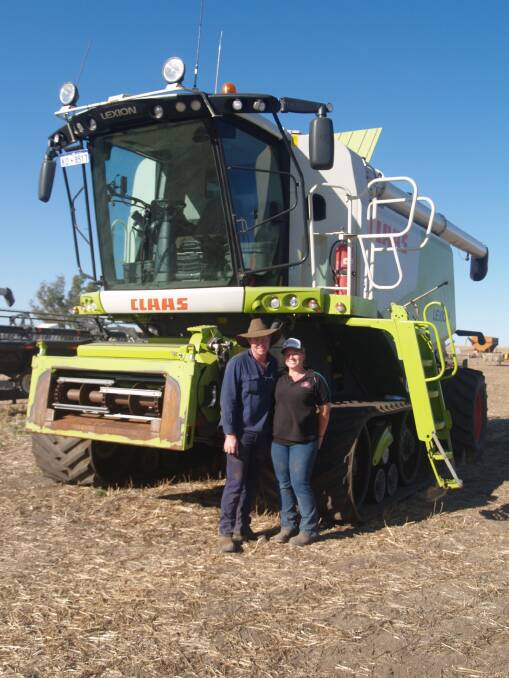  The last item offered, this CLAAS 750TT header (2738 engine hours and 1959 rotor hours), was offered without a front and was knocked down at $140,000. It is pictured with the new owners, Stuart and Emily Slade, Mt Barker.