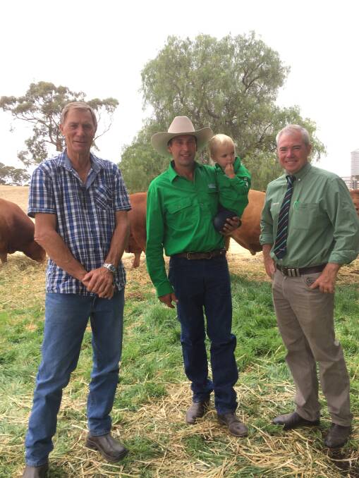 Pictured at the Maryvale Limousin stud sale at Kapunda, South Australia recently were WA purchaser Kevin Beal (left), Shannalea stud, Albany, with Maryvale principal Matt Vogt holding son Mostyn and Landmark auctioneer Leo Redden.