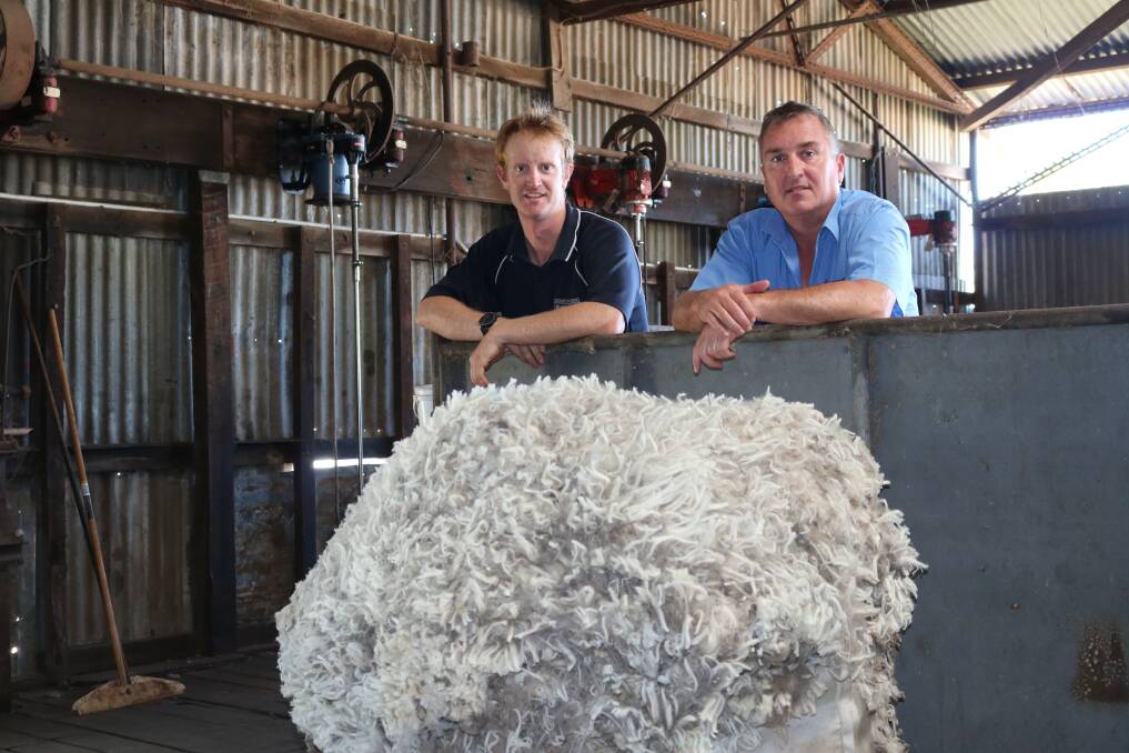 Dan Dempster (left), Southern Brook and Goomalling, with Westcoast Wool & Livestock broker and auctioneer Danny Ryan. The Dempster family's wool topped the sale on Wednesday last week at the Western Wool Centre.