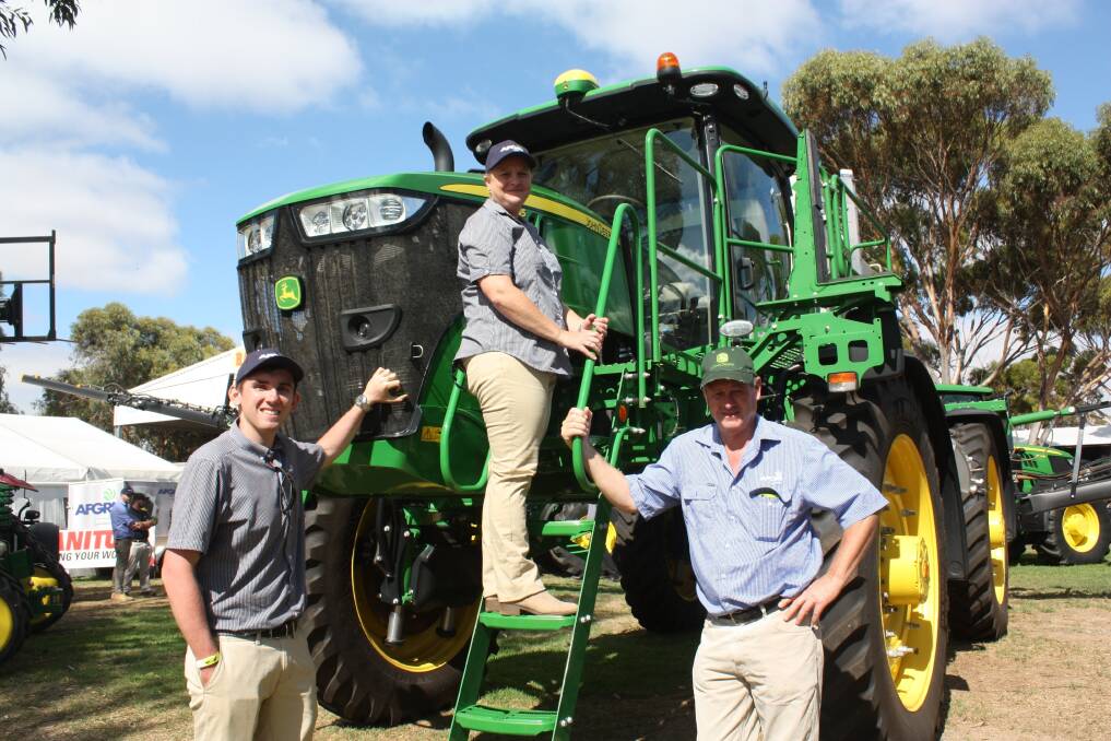 The big news at the AFGRI Equipment display at last week's Make Smoking History Wagin Woolorama was the unveiling of the new John Deere R4045 self-propelled boomsprayer. Here AFGRI marketing 	co-ordinator Tim Roberts (left), the company's Wagin parts interpreter Bev Wright and regional sales manager (southern region) Campbell Aiken provided Torque with a walk-around the new model.