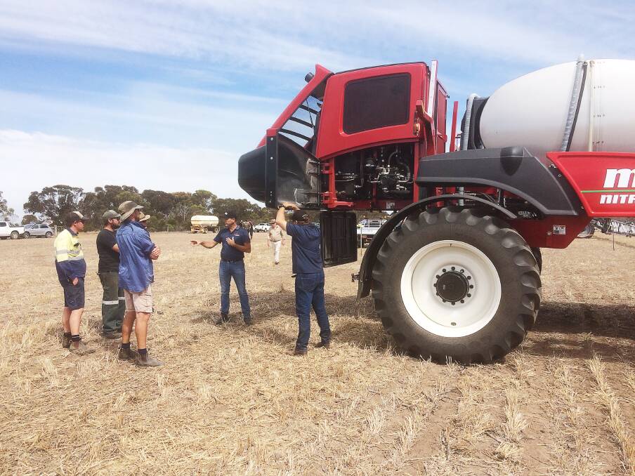  Growers pictured discussing the operation of the Miller Nitro 6000 Series sprayers and Miller Spray-Air system during the self-propelled sprayer ride and drive day held by Stirlings to Coast Farmers at the Peiper family's property near Woogenellup last week.