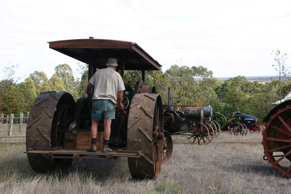 The late Tony Pailthorpe driving his beloved Titan Prairie Tractor, which was the last tractor he restored before he died in 2013. It will be put up for sale. 
