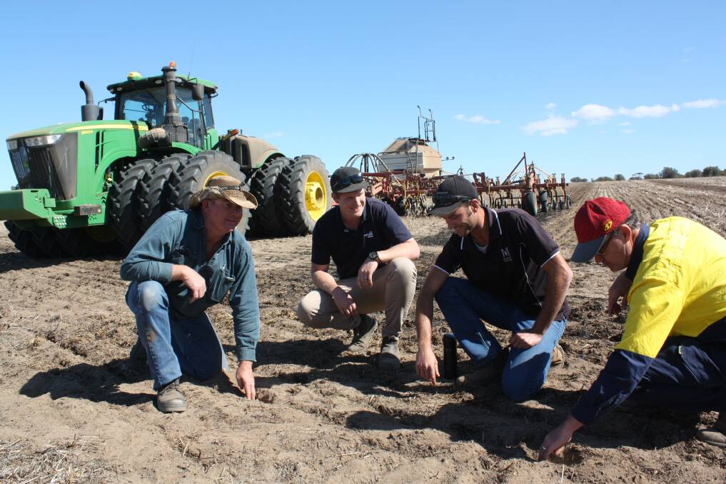 Blue skies meant a continuation of dry seeding canola last week for Lake Grace farmer Ed Naisbett (left) after starting a 5500ha program on April 17 sowing lupins. Mr Naisbett is with AFGRI Equipment Lake Grace branch manager Tyson Bell, tractor driver Roberto Fasono and farm manager John Ayers-Dillon. Photograph by Ken Wilson.