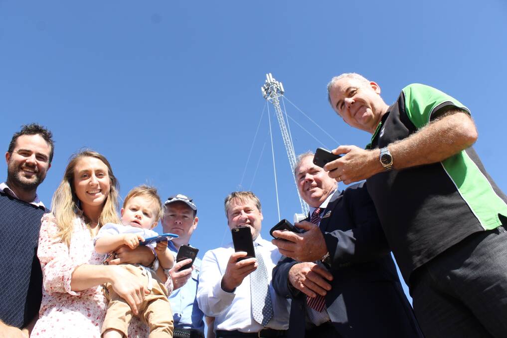 Kulin farmers Jarred West along with his wife Ashlee and young Hamish test the new signal from the new Kulin West tower. They are joined by Local police sergeant Paul Grosveld, Federal Member for O'Connor Rick Wilson, Kulin Shire president Barry West and Telstra area general manager Boyd Brown.