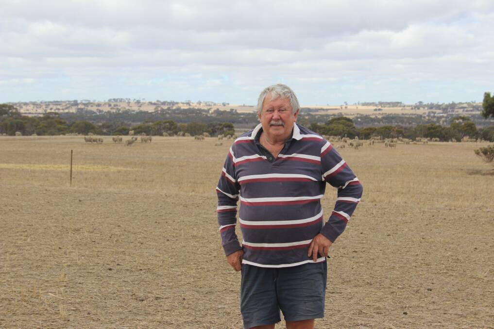 Wagin farmer Malcolm Edward on his dry paddocks where pregnant ewes have been feeding on hay, lupins and oats prior to lambing in the next few months.