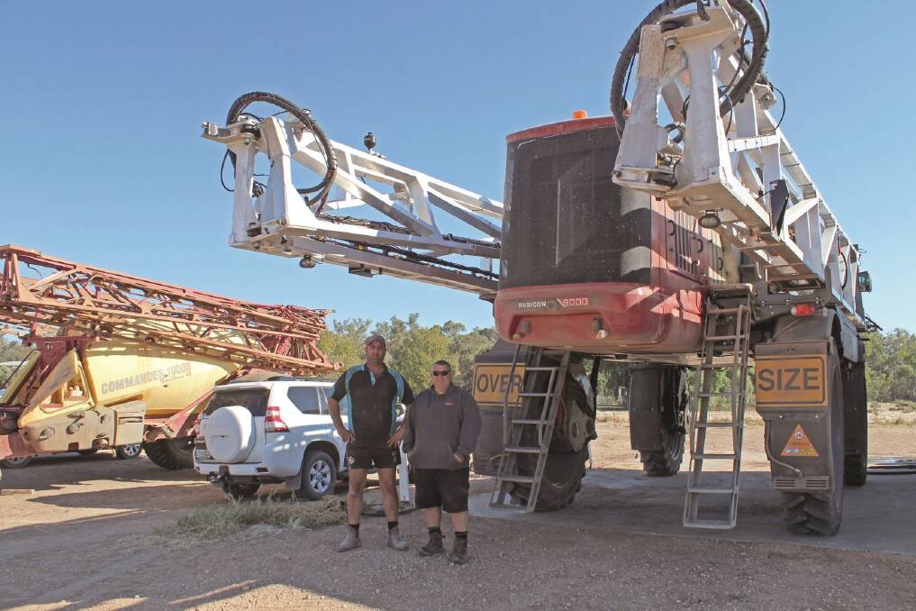 New South Wales farmer Matt Davies (left) and HARDI product manager Steve Lancaster review the performance of the HARDI RUBICON self-propelled boomsprayer which Mr Davies has used for the past 12 months.