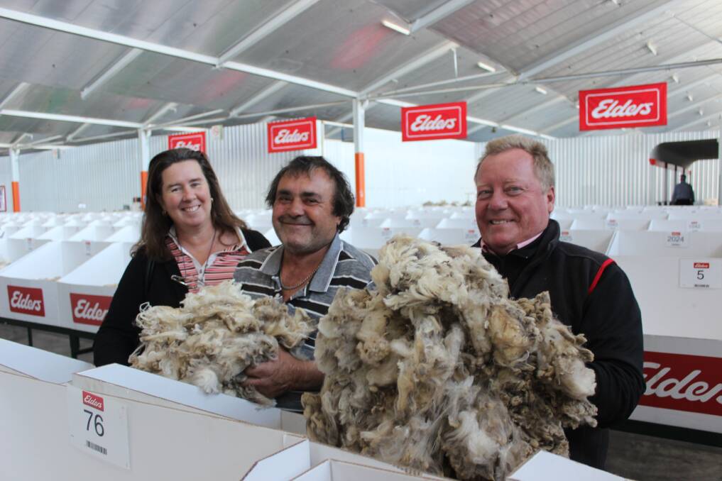 Jane and Barry Edwards, Wandering, with Tim Burgess, Elders district wool managerr and their wool samples on the show floor. Given the dry season, Mr Edwards was surprised at how sound his clip was.