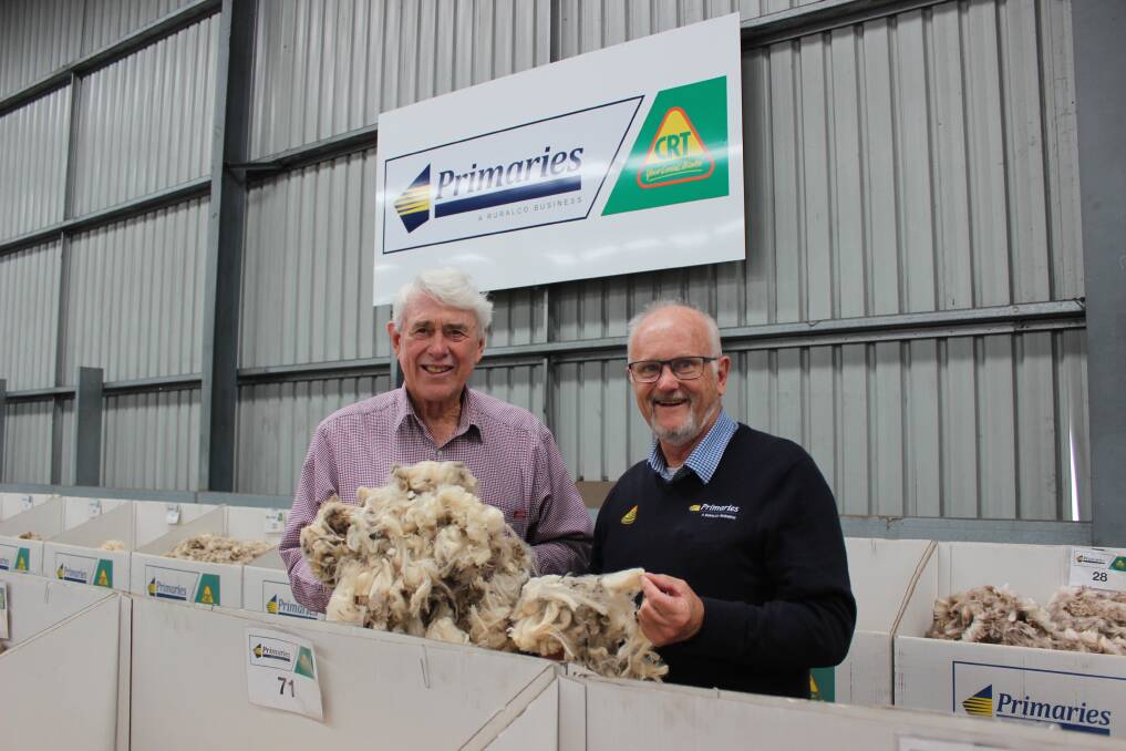 Des Shackley (left), Woodanilling, held fleece wool back from a September shearing and has been selling it for near record prices over the past three weeks at the Western Wool Centre. He is pictured on the Primaries of WA show floor with broker Tim Chapman.