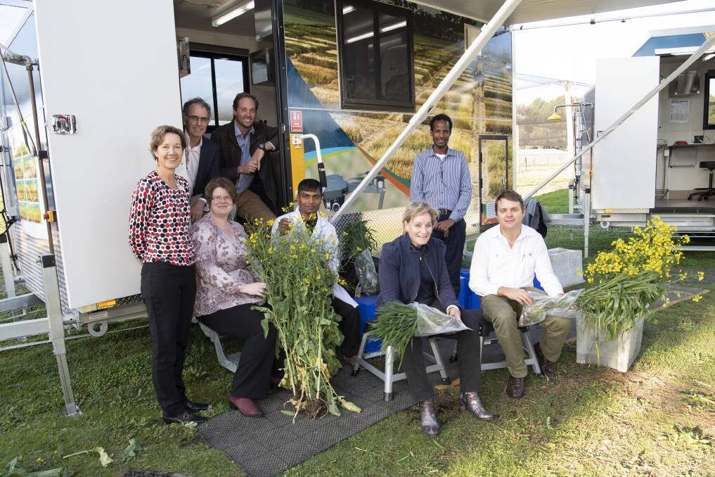  Agriculture and Food Minister Alannah MacTiernan (seated front) with Department of Primary Industries and Regional Development staff and the new mobile research vans. Photograph by Peter Maloney.