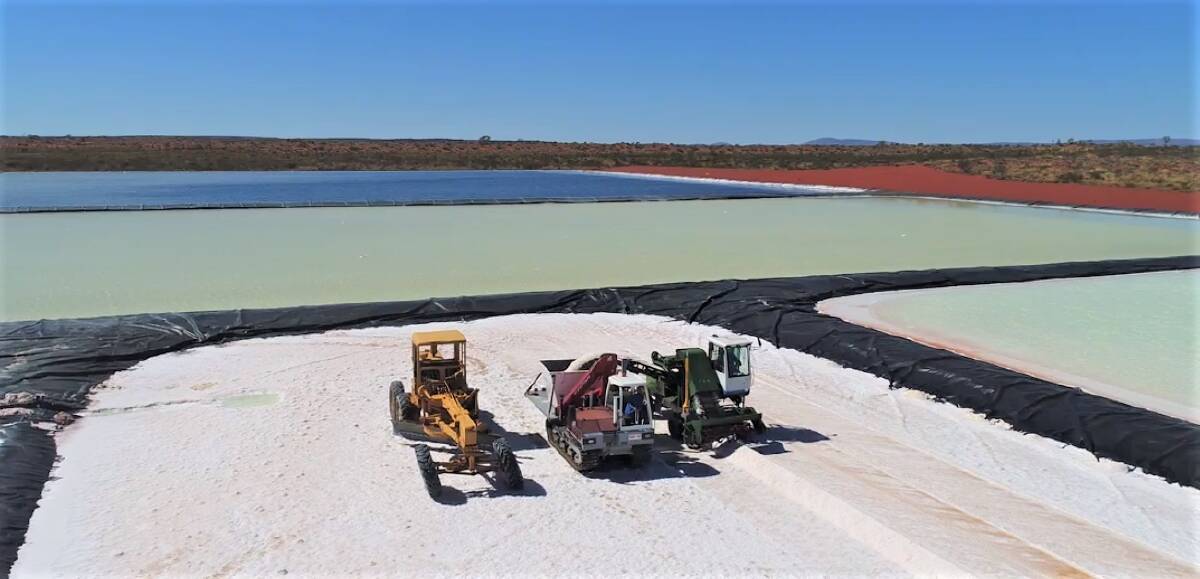 A grader, tracked bin vehicle and salt harvester on Kalium Lakes Ltd's trial evaporation ponds at its Beyondie Sulphate of Potash fertiliser project, 160 kilometres south east of Newman. A German government committee has indicated it might guarantee risk insurance cover for lenders financing part of the project.