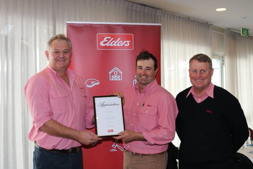  Elders state livestock manager Geoff Shipp (left) presented Elders Cranbrook agent Clark Skinner with a certificate of appreciation for 20 years of service, watched by zone sales performance manager Ian White.