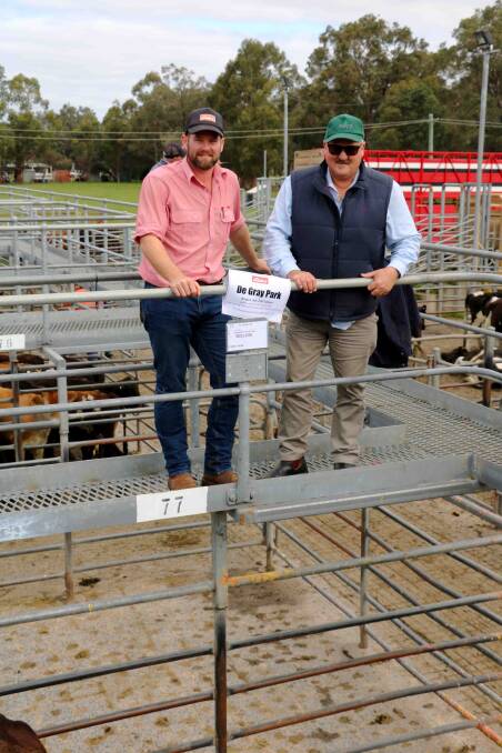 Elders Busselton representative Clint Gartrell (left), represented De Grey Park, Capel, which donated a cow and calf to Rural Aid to help drought effected producers in New South Wales. Greg Jones purchased the unit for Western Meat Packers, paying the top cow price of $1480.