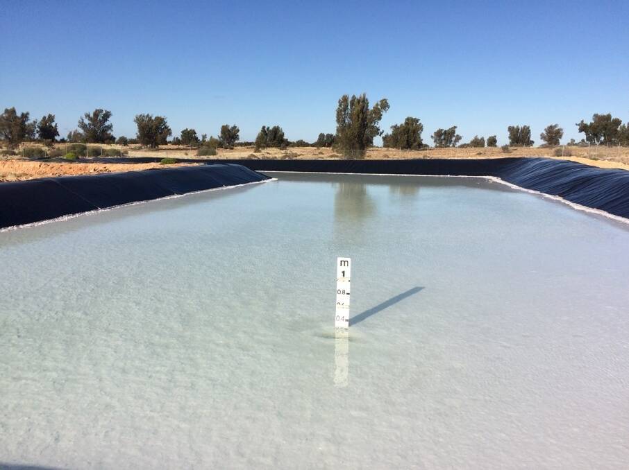 Hypersaline brine in an evaporation pond at Australian Potash's Lake Wells fertiliser project about 200 kilometres north-east of Laverton before it is pumped into a series of three smaller dams from where potassium salts will be harvested.