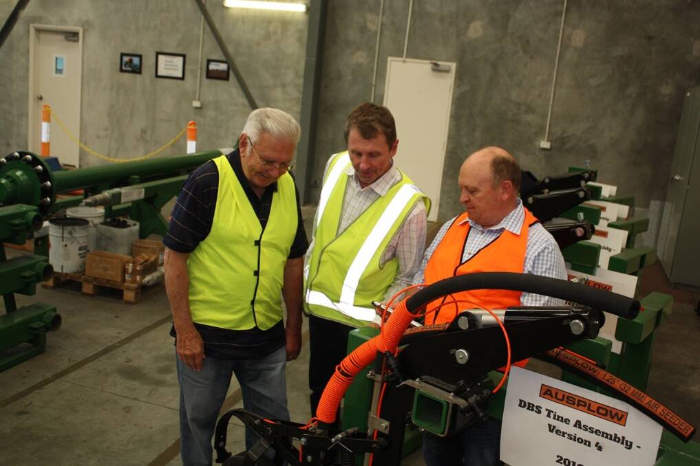  Nutrian director Dave Seagreen (right) talks with Ausplow managing director John Ryan (left) and Ausplow sales and marketing manager Chris Blight about trial work involving the company's DBS precision seeder fitted with a Friction Flow tubing kit. 
