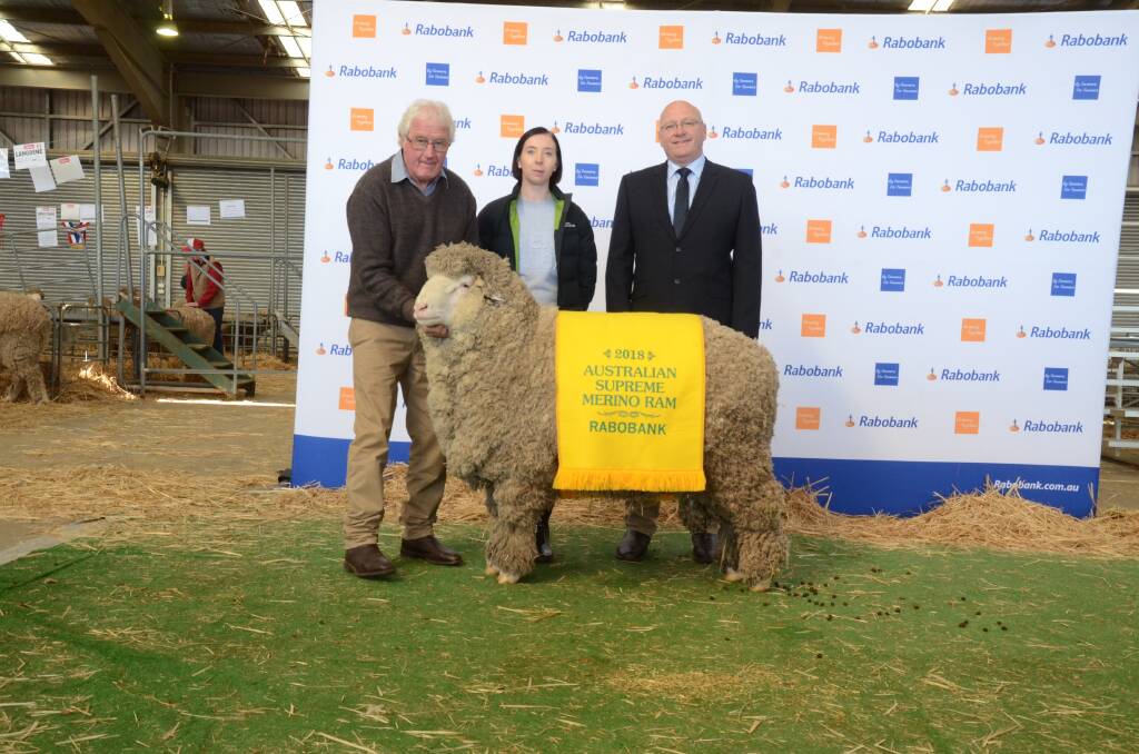  Robert (left) and Nicole Crawford, Rock-Bank stud, Victoria Valley, Victoria, with their Rabobank Australian supreme Merino ram, sashed by Rabobank deputy regional manager, Central NSW  Peter D'Esposito.