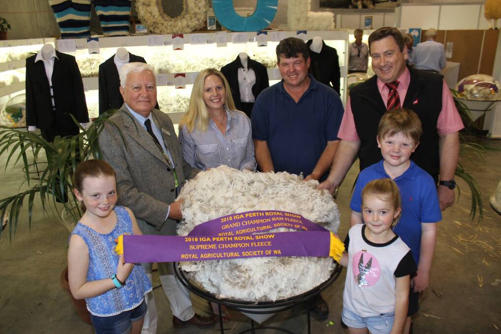 The supreme champion fleece at this year's IGA Perth Royal Show was exhibited by the Rangeview stud, Darkan. Pictured here with the winning fleece were RAS councillor in charge Ken Walker (left), Rangeview stud principals Melinda and Jeremy King, Darkan, Elders WA stud stock manager Tim Spicer and Melinda and Jeremy's children Gemma (front left), Erin and Tom.