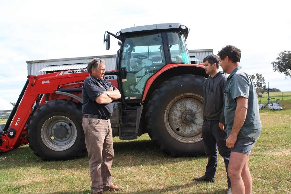P H Kerr Katanning dealer principal Brian Kerr (left) talks with Chad Corker and his father and Hiview Poll Merino stud principal Perry, about the performance of the new Massey Ferguson 7115 tractor. 