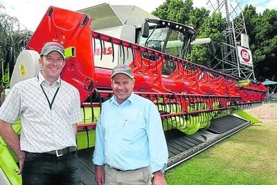 CLAAS sales and service Wongan Hills Dermot Joyce (left) and CLAAS sales Katanning, Paul Wells, in front of the new Lexion 750 at this year's Smoke Free Perth Royal Show.