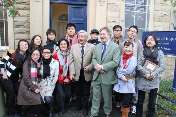 The Chinese media delegation, with Chinese media personality Cao Jinxing and Johnstons of Elgin director James Sugden in front, pose with their new wool purchases.