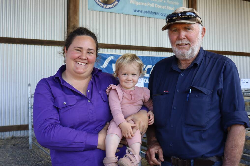 Emma Robertson (left) of Boyup Brook, with daughter Florence, 16 months old, and father-in-law Grant was the volume buyer on the day.