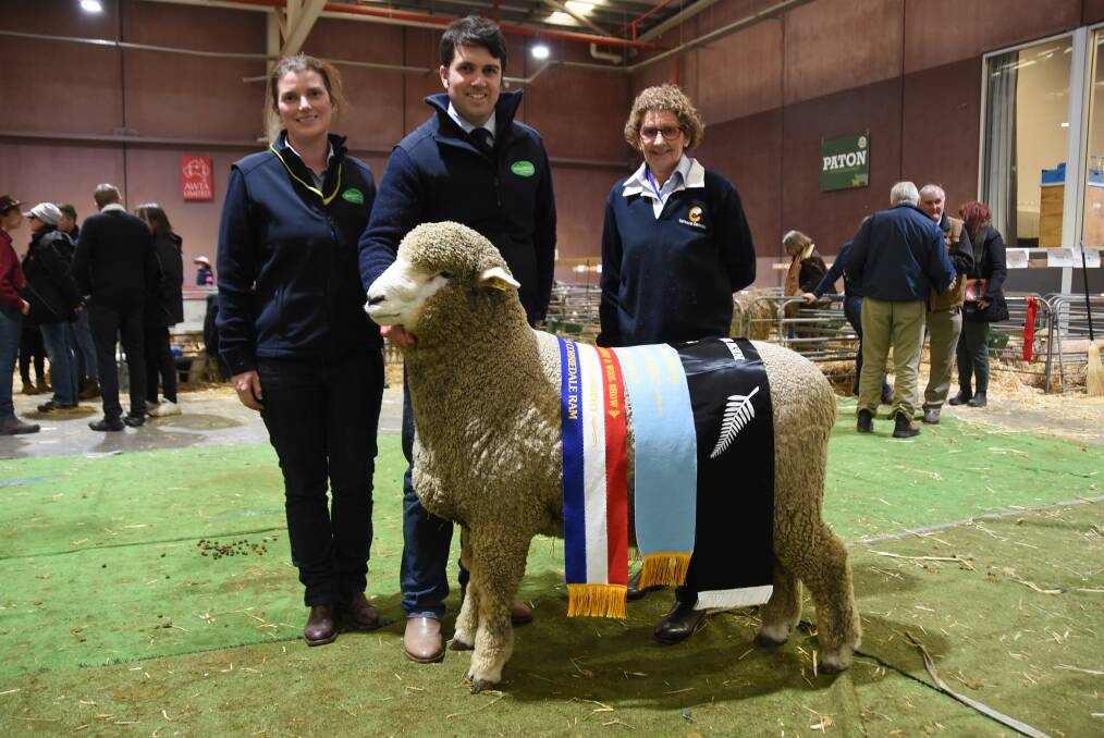 CORRIDALE CHAMPION: Casey Tomkins, Leigh Ellis and Bron Ellis from Sweetfield Corriedale stud with Rocky, the supreme champion of the Corriedale competition this year