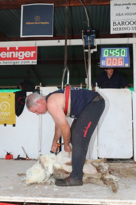 An action shot of the open final winner and shearing veteran Damien Boyle during the competition.