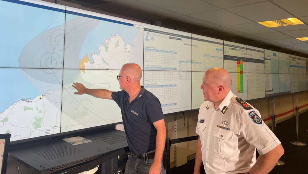Bureau of Meterology Western Australia and Northern Territory Manager Todd Smith (left) and Department of Fire and Emergency Services Commissioner Darren Klemm. The black line is where the cyclone is predicted to hit, and the grey section is areas likely to be affected by severe weather. Picture by Perri Polson