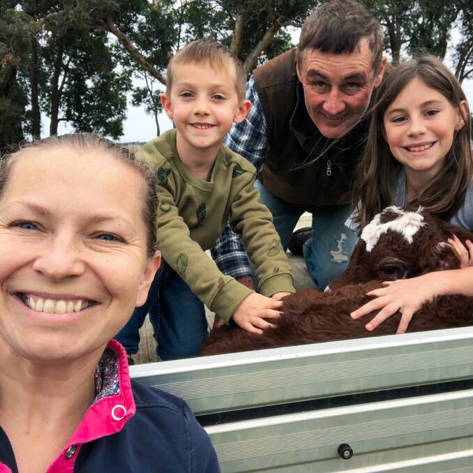Nicola and Shane Kelliher, with nine-year-old Johnny, Lucille, 13, and a young calf. 