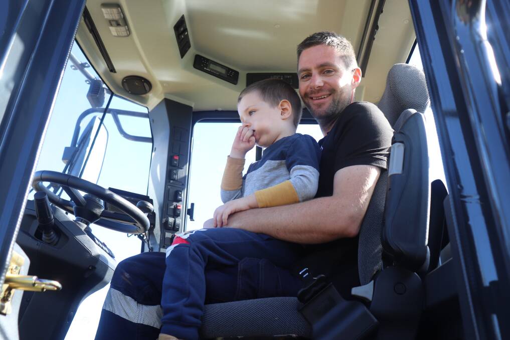 Colin Keaney, Keany Civil, Baldivis and son Finn, 4, in the cab of a 180kW, 19.5 tonne LiuGong 862H wheel loader.