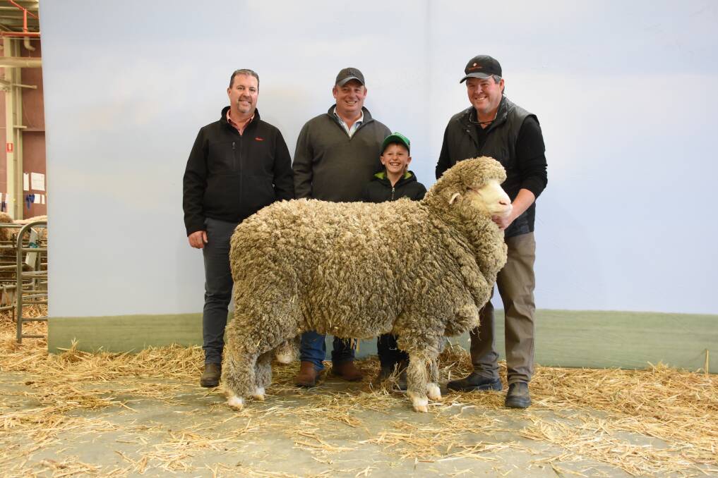 The Rangeview stud, Darkan, took out top price honours in the Merino ram sale at last weeks Australian Sheep & Wool Show at Bendigo, Victoria, when this Poll Merino ram sold for $24,000 to the Thalabah stud, Laggan, New South Wales. With the sale topping ram were Elders WA stud stock representative Nathan King (left), buyer Anthony Frost, Thalabah stud and his son Jack and Rangeview stud principal Jeremy King.